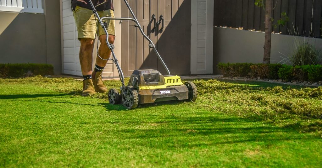 Mowing lawn to Scalp in preparation for Lawn Renovation